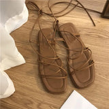 Women Summer New 2023 Beach Fashion Sexy Flat Casual Cross-Tie Open Toe Fairy Style Narrow Band Shoes Black Rome