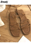 Womens Summer New 2023 Beach Fashion Sexy Flat Casual Cross Tie Open Toe Dress Fairy Black Roman Sandals Womens